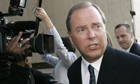 Former Enron CEO Jeff Skilling, left, leaves the federal courthouse after being sentenced to 292 months in federal prison on October 23 2006 in Houston.