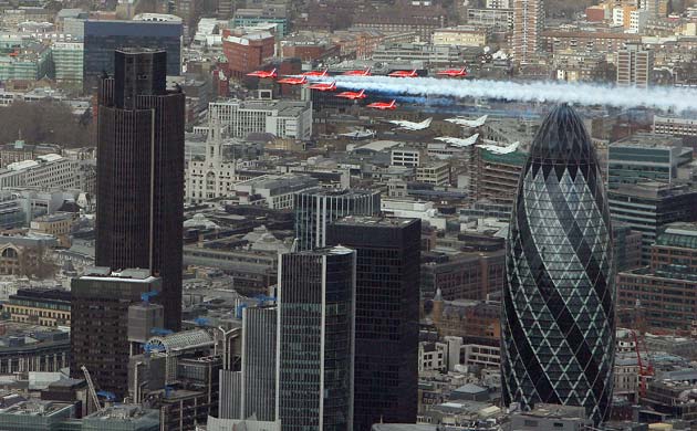 Red arrows fly past the Gherkin