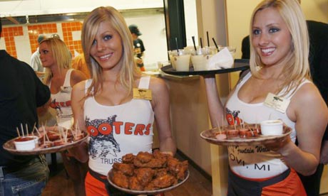 Waitresses serving food and beverages at Hooters which plans to open a 