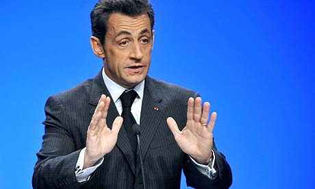 French president Nicolas Sarkozy gestures as he speaks in Neufchateau 