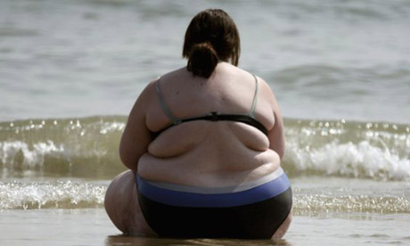 Obese woman on beach