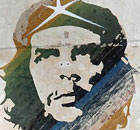 Cuban near Che Guevara mural