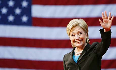 Hillary Clinton waves to the crowd at the National Building Museum in Washington