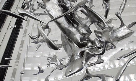 A giant sculpture representing a splash of water is hung from a building at the Expo 2008 in Zaragoza