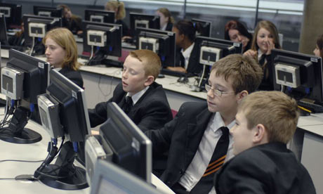 Pupils work at computers at the Thomas Deacon City Academy in Cambridgeshire
