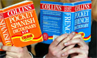 Students hold French and Spanish dictionaries