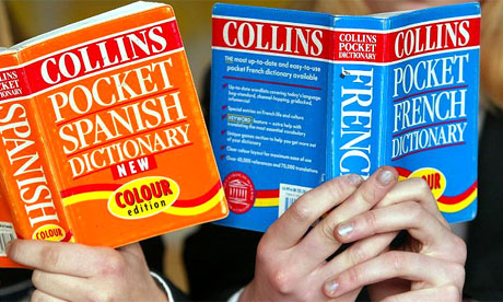 Students hold French and Spanish dictionaries