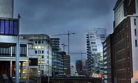 Flats under construction in Manchester, showing cranes in the background