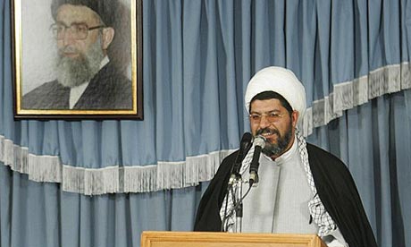 Ali Shirazi, an aide to Supreme Leader Ayatollah Ali Khamenei,  speaks under a picture of the supreme leader in Tehran