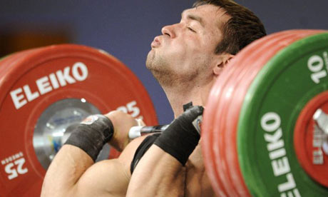 Russia weightlifter Vasily Polovnikov controls his breathing as his lifts in men 85kg category