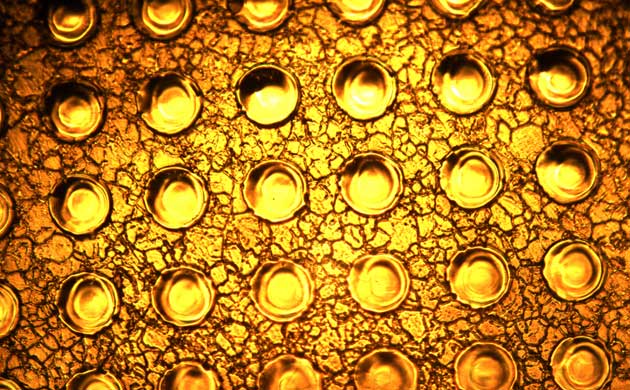 Holes drilled by pulsed fibre laser