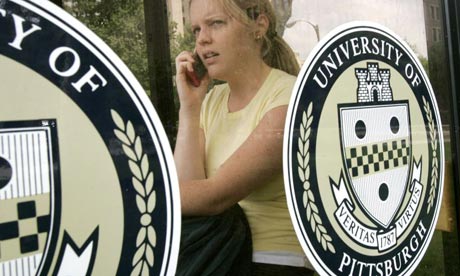A student talks on her mobile at Pittsburgh University, where the cancer institute is based