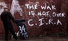 Graffiti from the Continuity Irish Republican Army (CIRA) on an alley wall in West Belfast