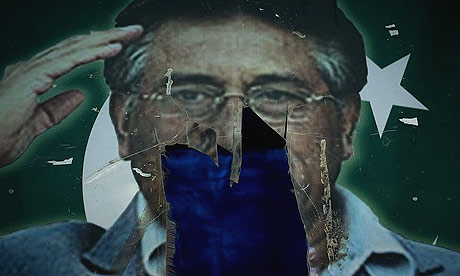 A photo of Pakistani president Pervez Musharraf is seen partially torn down at a water plant on the outskirts of Islamabad.