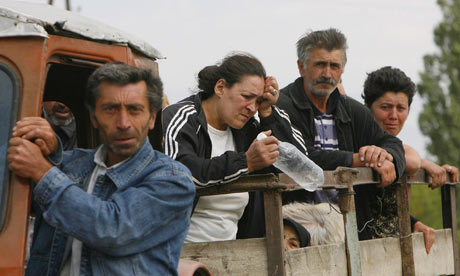 Georgians leave their village near the town of Tskhinvali, Georgia. Photograph: David Mdzinarishvili / Reuters