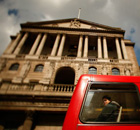 A bus passes by the Bank of England
