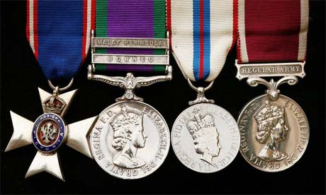 A Gurkha soldier displays his medals