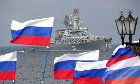 Pro-Moscow supporters welcome the Russian missile cruiser Moskva as it enters Sevastopol Bay on Ukraine's Crimea peninsula