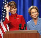 In this photo provided by NBC, actor Tina Fey, left, plays Sarah Palin, and Amy Poehler plays Hillary Clinton on Saturday Night Live 
