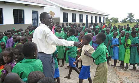 Headteacher Ben Ejadu assembles children at Amorikot primary school, Katine, at the start of the new term
