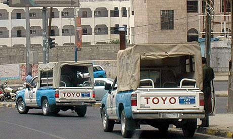 yemeni people. Yemeni forces block a street