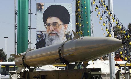 A missile in front of a poster of the Iranian supreme leader Ayatollah Ali Khamenei during a military exhibition in Tehran, Iran