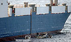 Somali pirates hijack the MV Faina, a Ukrainian cargo ship.
