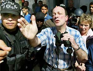 Anthony and Jocelyn Hurndall, accompanied by a guide, see the location where their son Tom was shot in the southern Gaza strip in April 2003. He was hit by Israeli gunfire as he tried to help Palestinian children across a street. Photograph: Reuters