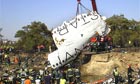 The wreckage of Spanair flight JK5022 is lifted from a field near Madrid's Baraja airport. 154 people died in the crash