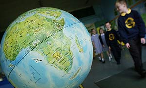 Katine: A globe showing Africa in a year 2 geography lesson at Partington primary school in Trafford, Greater Manchester