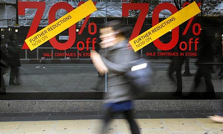 A shopper walks past a store on Oxford Street in London