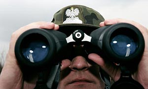 A Polish border guard on watch. British police say Poland is responsible for a large number of trivial extradition requests
