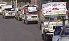 Fruit dealers from Indian Kashmir drive towards the de facto border with Pakistani-controlled part of the state