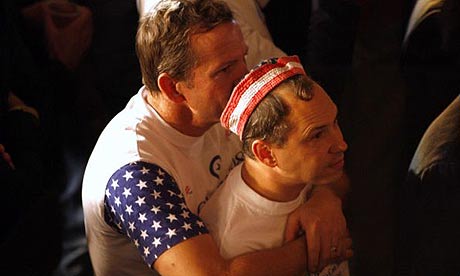 A couple watches Barack Obama's acceptance speeach in Hollywood. Photograph: Mario Anzuoni/Reuters