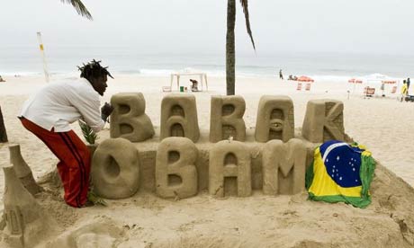 A sand artist in Rio de Janiero pays tribute to Barack Obama. Photograph: Antonio Scorza/AFP/Getty Images