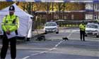Police officers guard the scene after the fatal shooting of a 15-year-old boy in Derby