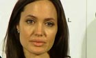Angelina Jolie fights back tears as she talks about her late mother at a London press conference