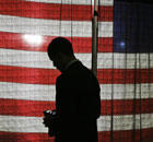 Barack Obama consults his wireless device on the campaign trail