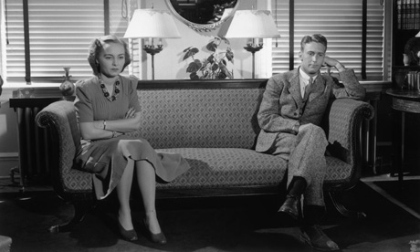 Couple sitting apart after arguing