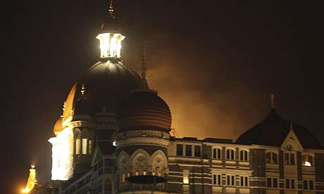 Smoke emerges from behind a dome on the Taj Hotel in Mumbai, India, after it was attacked by terrorists