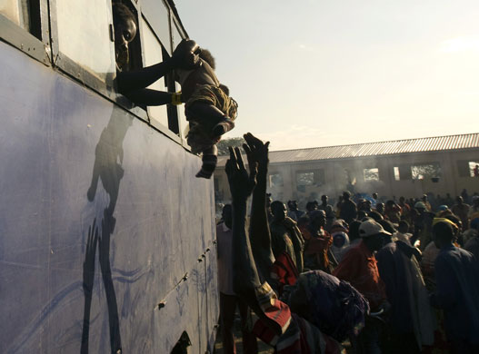 Gallery December 1 2008: A bus leaves for Ishasha refugee transit camp on the Congo-Uganda border