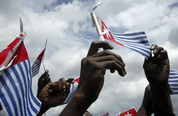 Gallery December 1 2008: Papua province, Indonesia: Protestors hold Papua's flag during a rally
