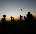Youths play football at the al Shatea refugee camp