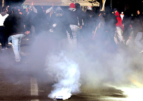 Gallery Greek Riots Continue: Young protestors escape from tear gas