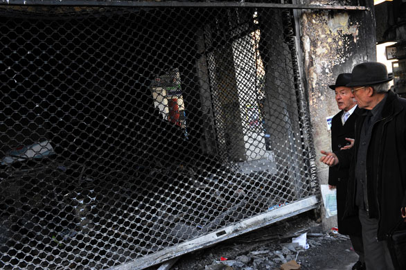 Gallery Greece riots: A burnt-out shop in Thessaloniki