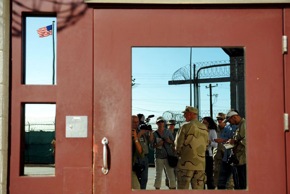 Gallery 24 hours in pictures: Commander Jeff Hayhurst, briefing journalists at Guantanamo Bay