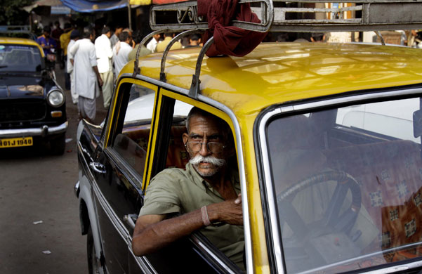 Gallery 24 hours in pictures: taxi driver waits for customers