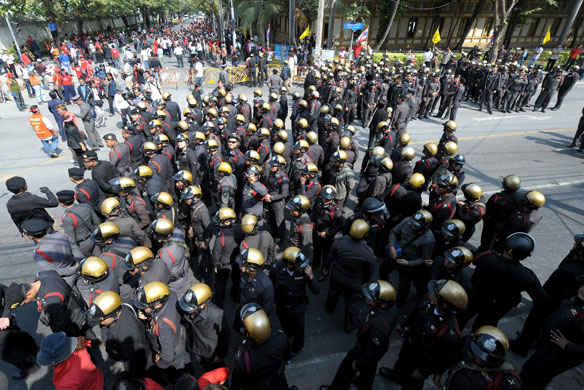 Thailand: Thai policemen and protestors outside  Parliament in Bangkok