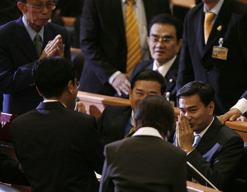 Thailand: Vejjajiva greets members after arriving at Parliament in Bangkok