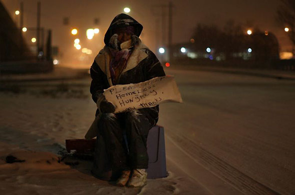 Gallery 17 December 1008: Detroit, US: A homeless woman begs for money